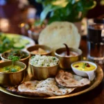 closeup shot indian tasty food called marwari veg thali wooden table scaled