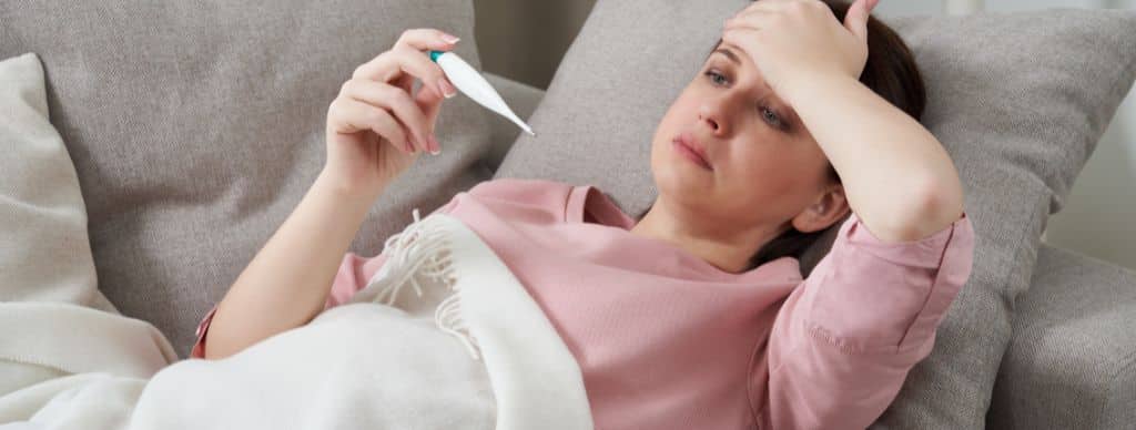 woman looking thermometer female hands holding digital thermometer